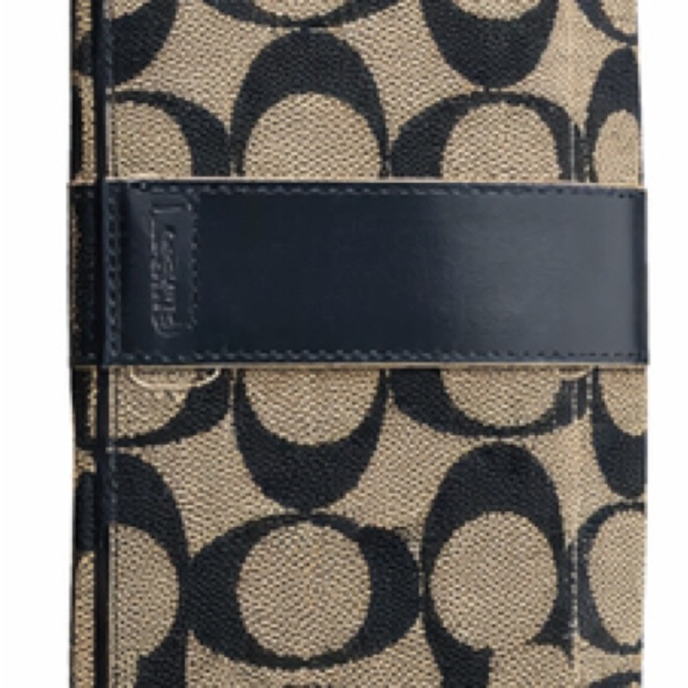 Coach signature monogram trifold wallet in black and cream with leather trim.